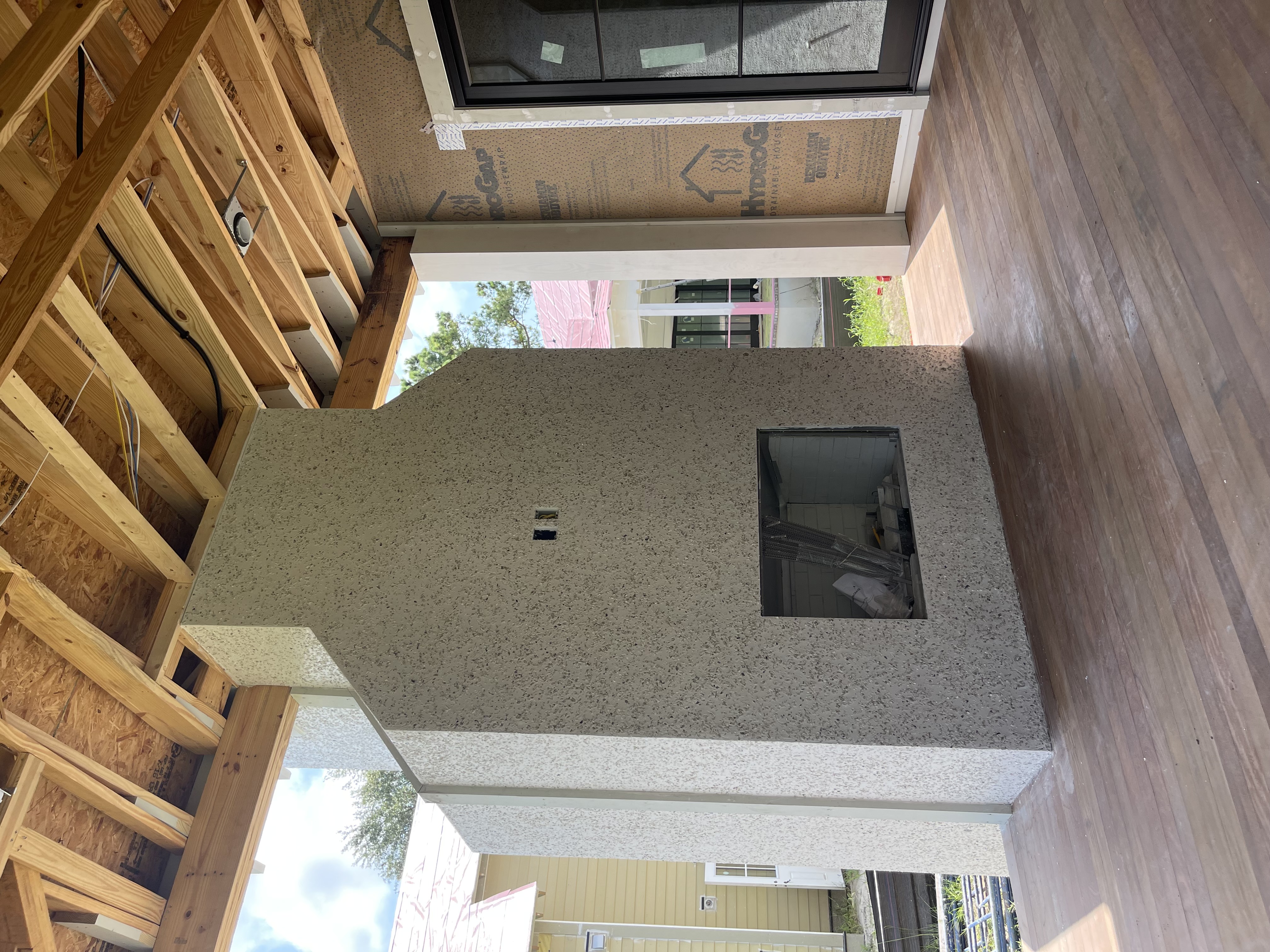 Custom home exterior with herringbone brick facade and board-and-batten siding