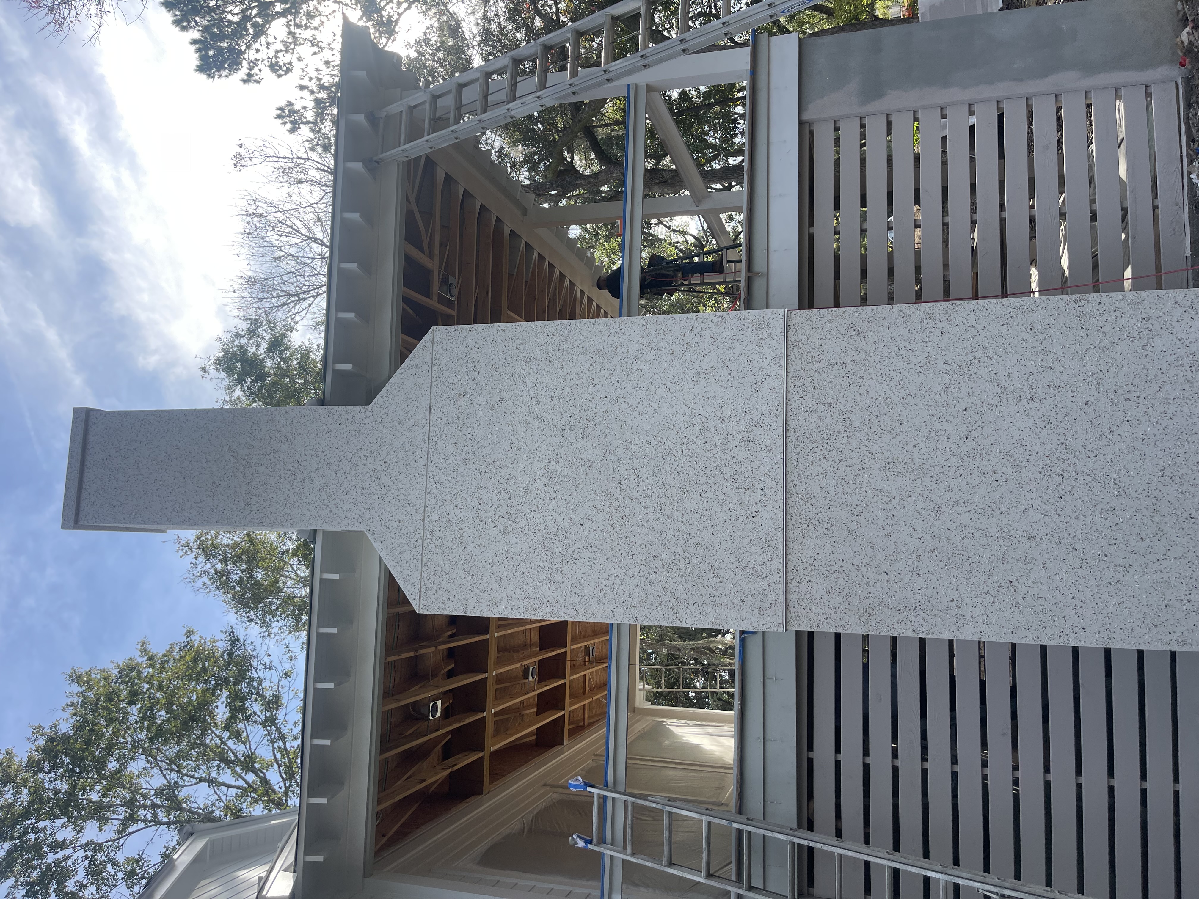 Smooth stucco finish on exterior columns and walls