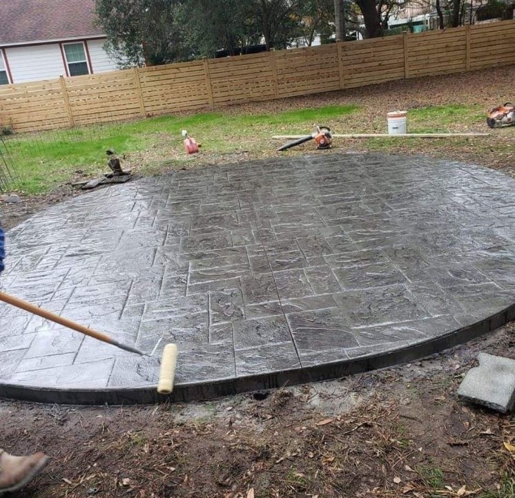Stamped concrete patio with decorative stone pattern